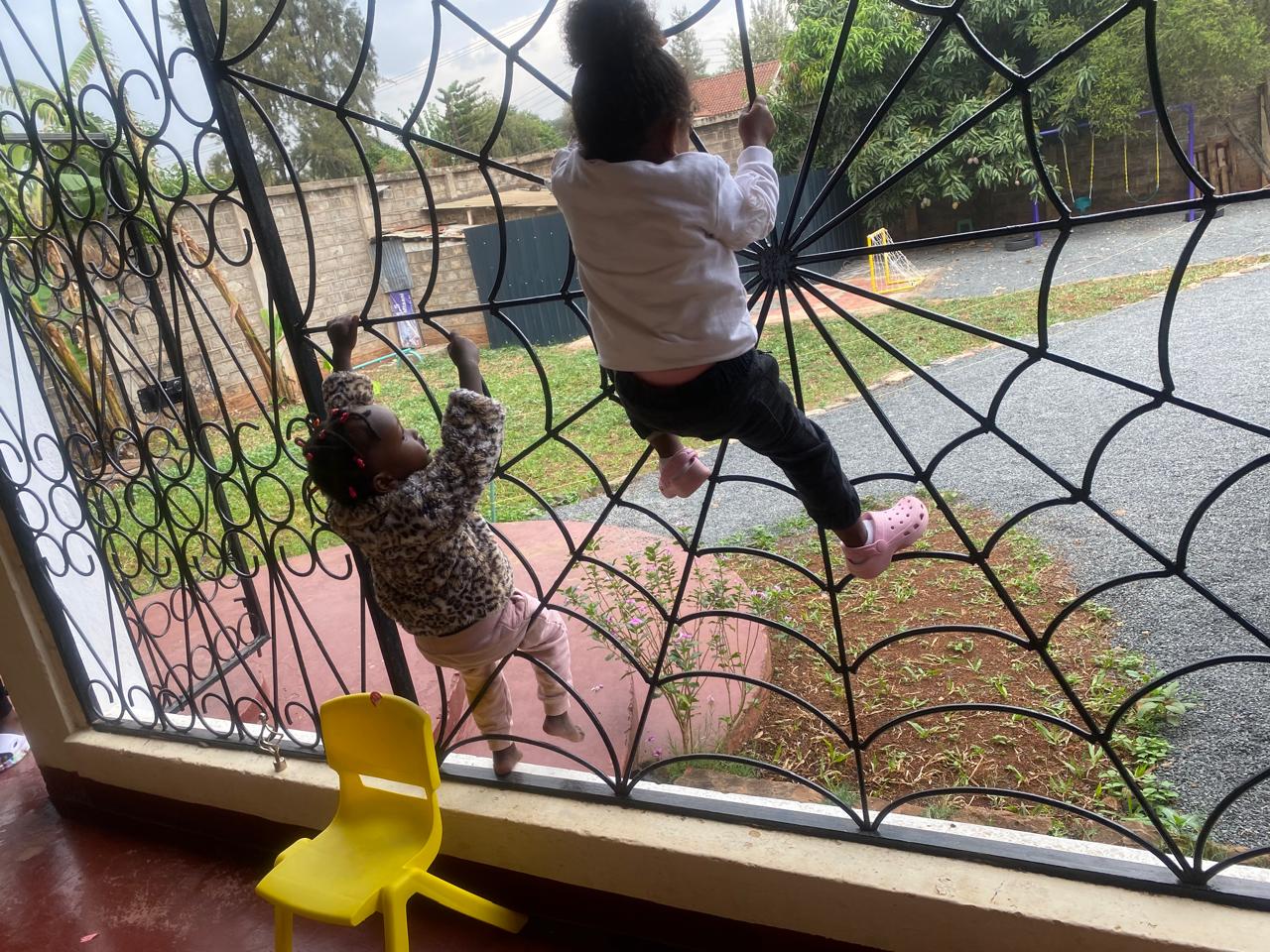 Young children playing and climbing